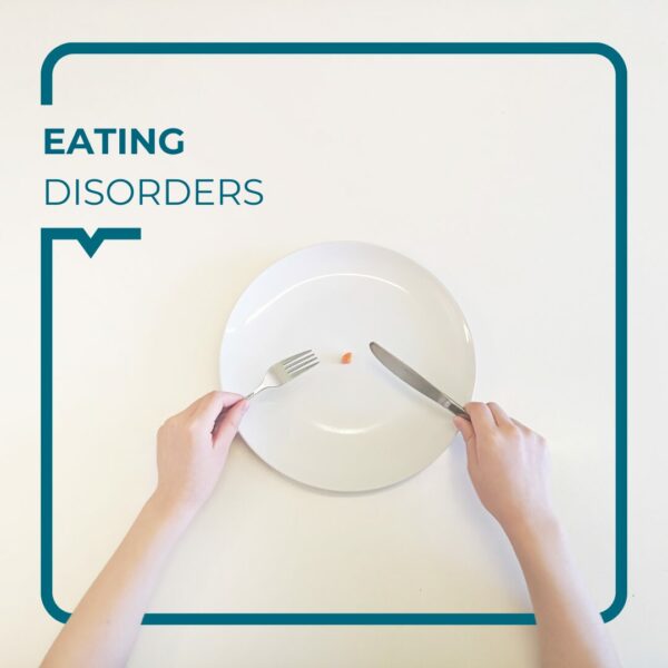 Hands with cutlery eating from an empty plate