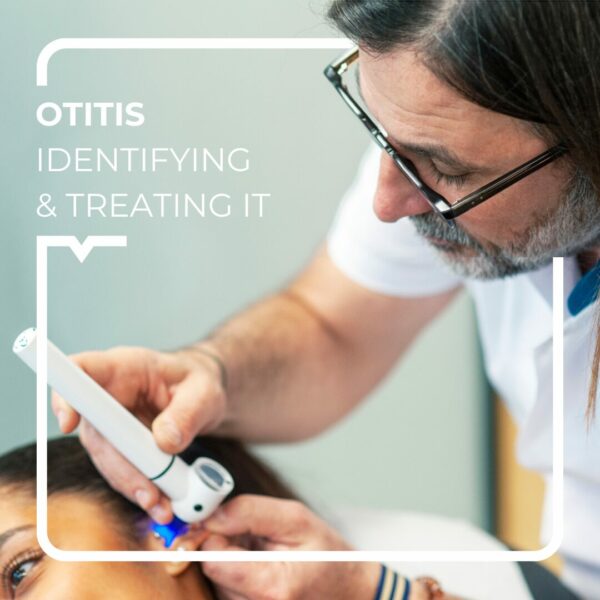 Doctor looking into a patient's ear to check for otitis